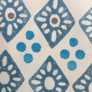 patterned lozenge and four dots blue