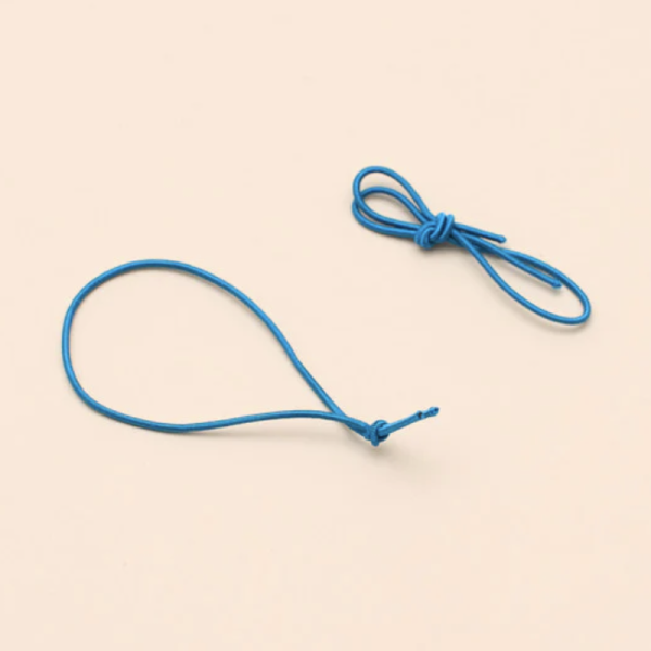 A pair of spare blue elastic ribbons for the Pocket Folio.