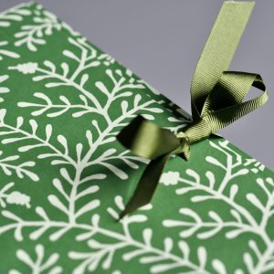 detail of Cambridge Imprint Portfolio covered in Sprig Pea Green paper