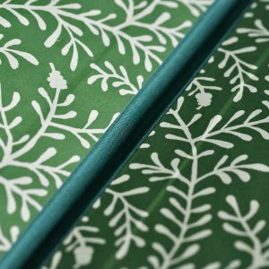 detail of Cambridge Imprint Portfolio covered in Sprig Pea Green paper