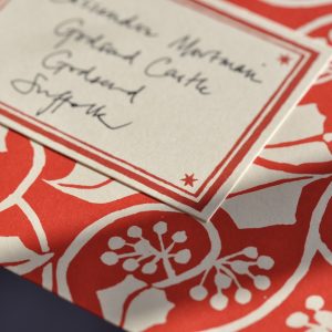 Small Ivy Stripe patterned envelope and crimson address label